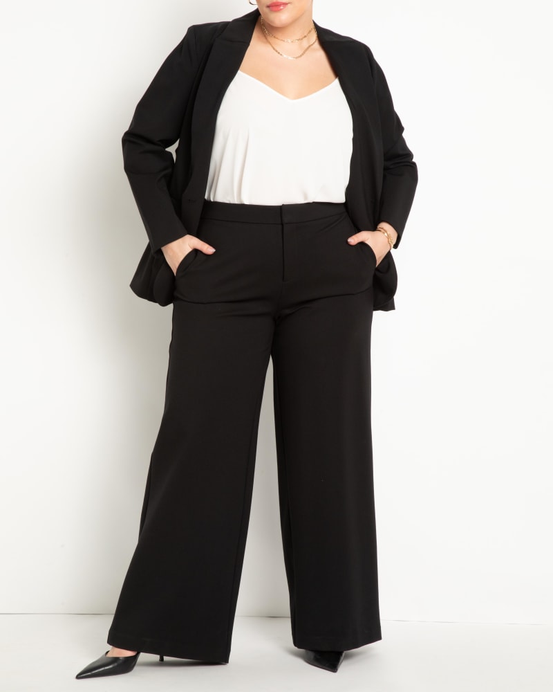 Front of a model wearing a size 24 The Ultimate Stretch Suit Wide Leg Pant in Totally Black by ELOQUII. | dia_product_style_image_id:273029